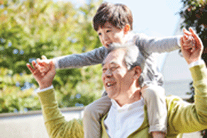 Photo of grandpa and grandson width happy smiles.